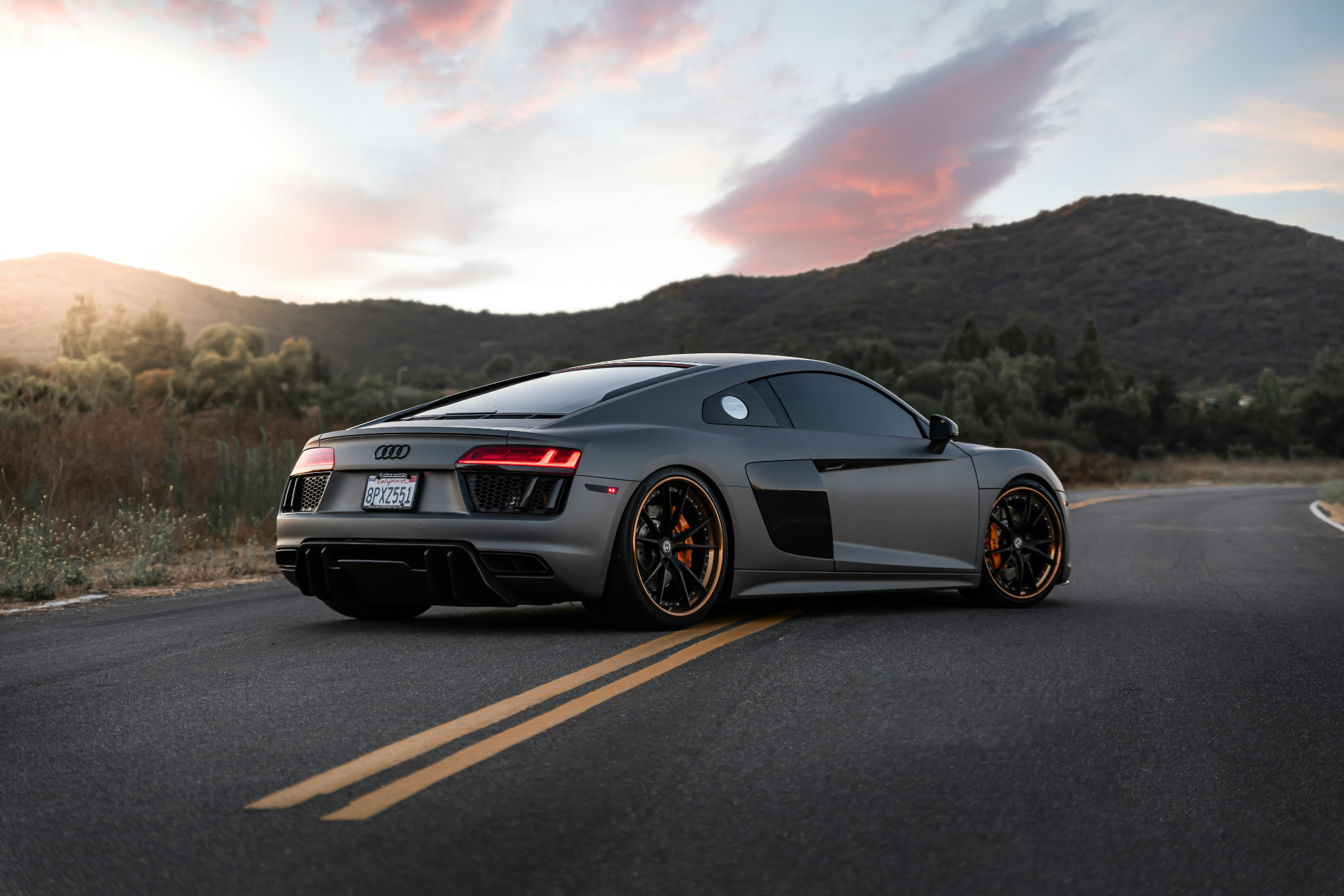 Audi R8 on canyon road at sunset